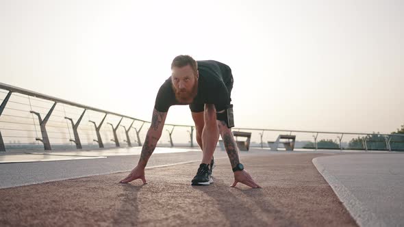 Mature Athlete Gets Up Starting to Run Short Distance