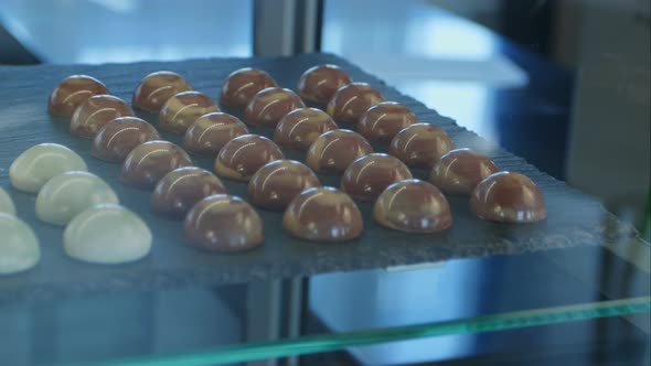 Chocolate and White Chocolate Candies in Shop Window