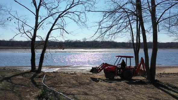 ‎⁨A low angle view of Rancocas Creek on a sunny day. The camera pan right following a man maneuverin