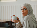 Muslim woman on remote working, online education or video conversation in caffe - PhotoDune Item for Sale
