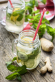 Homemade detox lemonade with cucumber, ginger and mint in retro mason jar glass on wooden table. - PhotoDune Item for Sale
