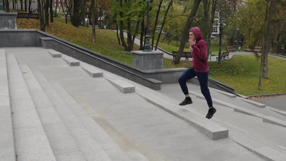 Jogger in Hoodie Running on Stairs