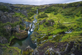 Gjain watrfall cascade, colorful lava rocks valley - PhotoDune Item for Sale
