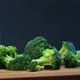 Fresh Green Broccoli Sprinkled with Salt Lying on Board - VideoHive Item for Sale