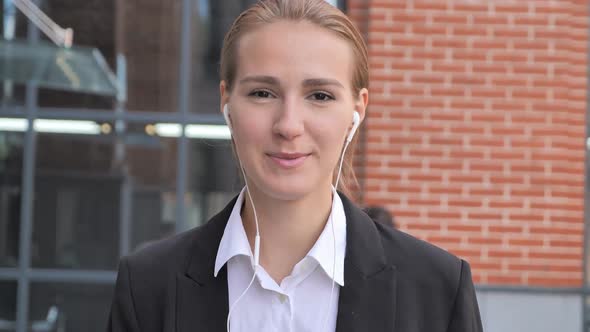 Online Video Chat By Businesswoman Walking Ouside Office