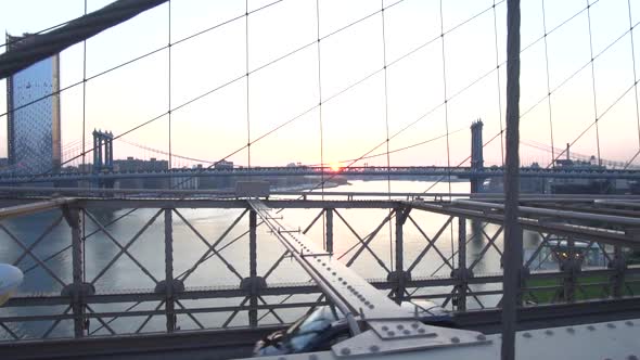 On Brooklyn Bridge Looking Into East River No People with Cars, Traffic Passing the Bridge Summer