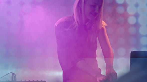 Blond DJ Woman Performing on Concert