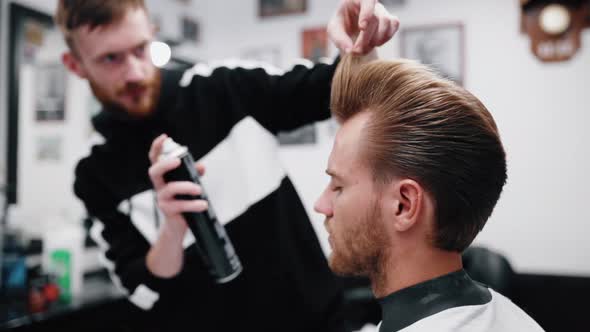 Stylish Men's Haircut. Barber Makes Hair Styling Special Varnish