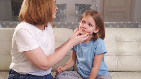 a Girl Complains of Pain in Ear and Her Mother Examines It