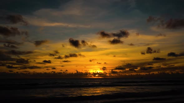 Time Lapse Silhouetted  on the beach at sunset.Dramatic sea sunrise