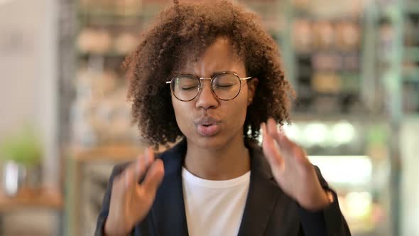 Exhausted African Businesswoman Having Headache