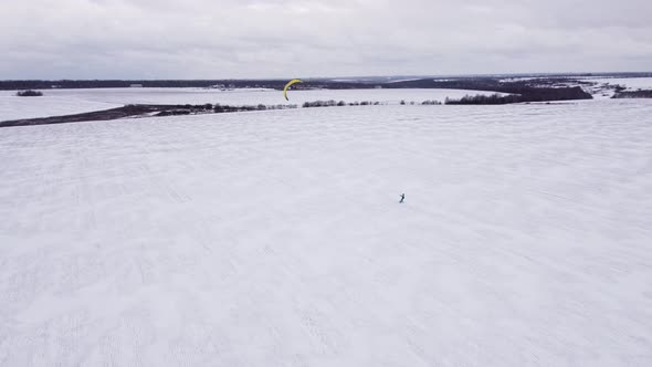 SnowKiting Kitesurfing Sport on the Ice Lake Winter