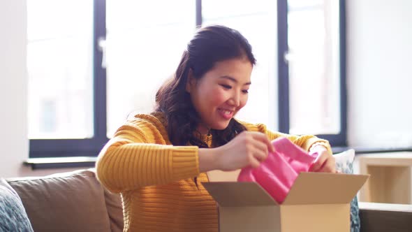 Happy Asian Young Woman with Parcel Box at Home