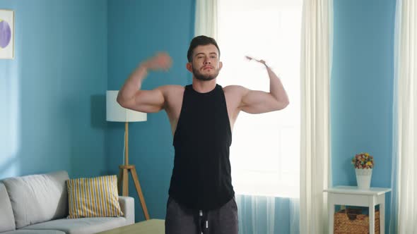 Strong Man Is Doing Arm Circles