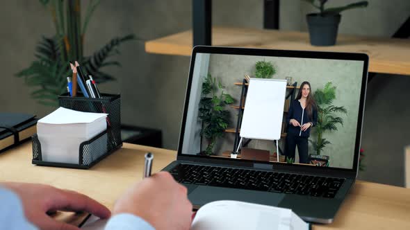 Woman Teacher in Computer Screen Greets Tells Teaches Remote Video Call Laptop