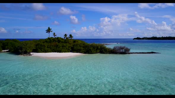 Aerial above seascape of exotic resort beach adventure by shallow ocean and white sand background of