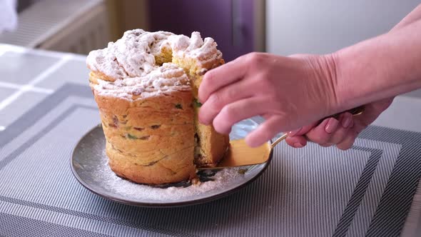 Woman Taking Piece of Traditional Easter Cruffin Cake  Happy Easter Concept