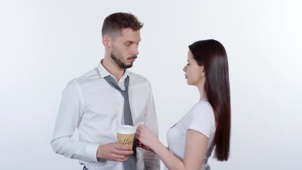 Woman Giving Coffee to Tired Businessman