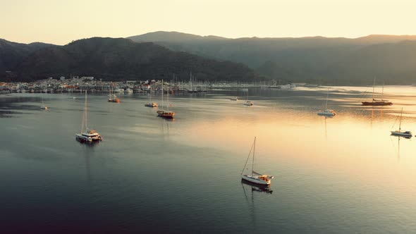 Landscape Panorama with Yacht in Harbor and Mountains in the Background