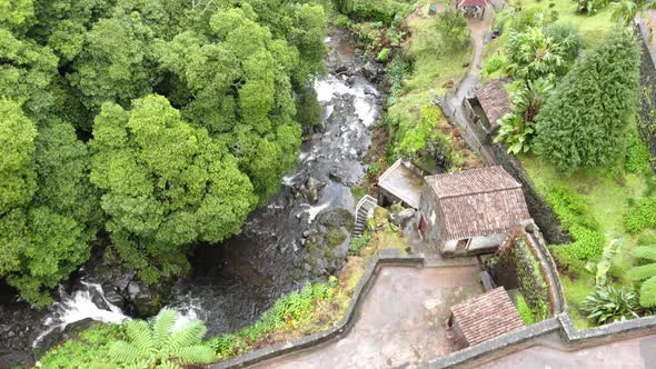 Historic water Mill in Ribeira dos Caldeires natural park near cascading waterfall 