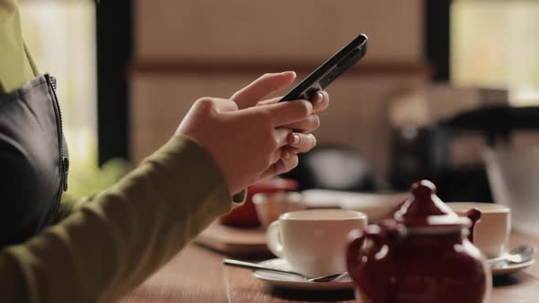 Smartphone in a Female Hands