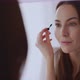 Woman Painting Eyebrows Near Mirror - VideoHive Item for Sale