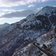 Backward Aerial Top View Along Road on White Snow Mountain in Winter - VideoHive Item for Sale