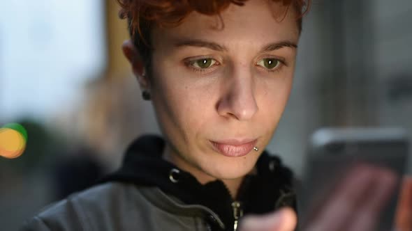 Portrait of young woman lesbian using smart phone