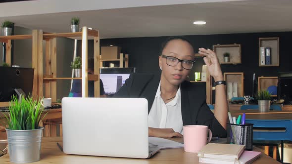 Overworked African American Woman Feeling Tired and Sleepy While Sitting at Office