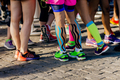 group female runner legs before marathon race - PhotoDune Item for Sale
