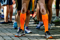 legs male runner in compression socks and kinesio tape on his knees - PhotoDune Item for Sale