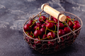 Fresh sweet red cherries in the basket on dark background - PhotoDune Item for Sale