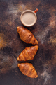 Coffee and croissant on stone background. - PhotoDune Item for Sale