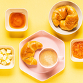 Coffee and croissants for breakfast on a yellow background - PhotoDune Item for Sale