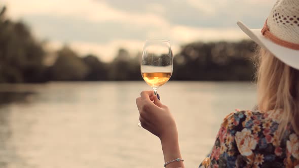 Lady Relaxing After Hard Working Day And Celebrating Holidays Vacation. Woman Drinking White Wine.