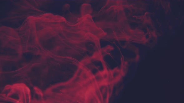 Abstract Red Ink Flowing in Water