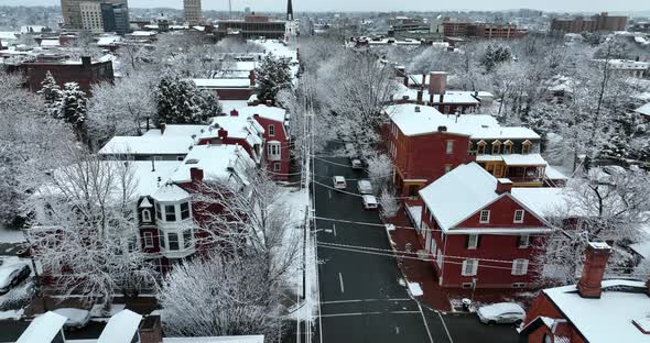 Lancaster Pennsylvania skyline. Winter snow scene tracking vehicle on street. Fresh snowfall covers