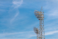 Stadium light against blue sky. Sports architecture and equipment - PhotoDune Item for Sale