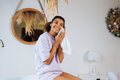 African american woman takes care of her skin in the bathroom - PhotoDune Item for Sale