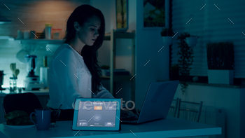 command to tablet with smart home application and lights turning on. Person using notepad with high tech wifi app software controlling room ambiance