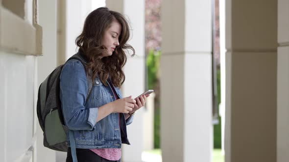 Young woman looking at smartphone