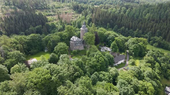 drone footage of  Wildenburg Castle in the southeast of the village of Friesenhagen in the North Rhi
