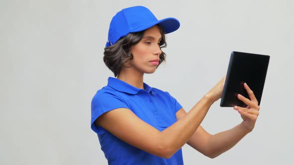 Delivery Girl in Blue Uniform with Tablet Computer