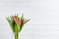 tulips with white old wood plank wall - PhotoDune Item for Sale