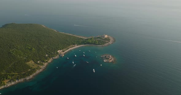floating boats and yachts with Otocic Gospa island and fortress arza on background