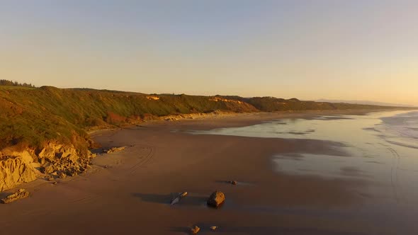 Aerial footage drone flying forwards over Whiskey Run, a beach near Bandon at the Southern Oregon co