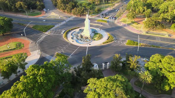 Buenos Aires Drone view over Palermo park Libertador Avenue traffic scene tilt up to city landscape.