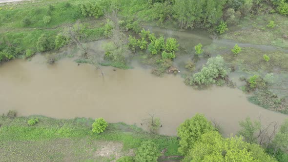 River stream from above after heavy flooding 4K aerial video