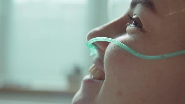 Female Patient with Nasal Cannula Smiling in Hospital