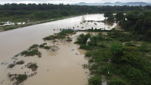 Fly over the river bank flooded